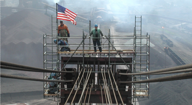 Solid Platforms crew standing high above a job site on scaffolding they erected